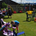 Harry gets the picnic chairs ready.